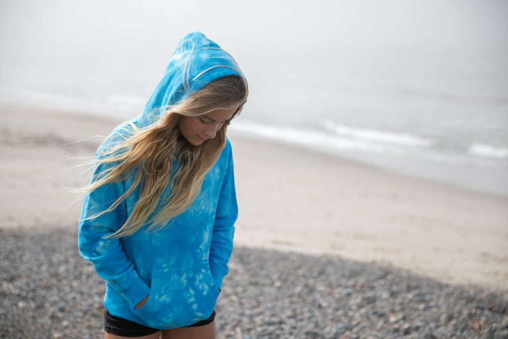 girl wearing summer sweatshirt and shorts