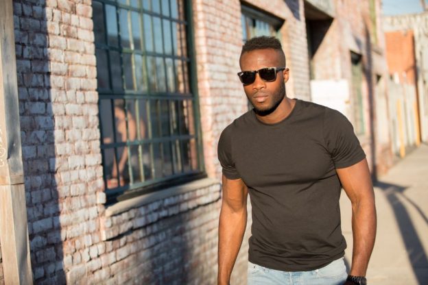 man on the street wears black t-shirt